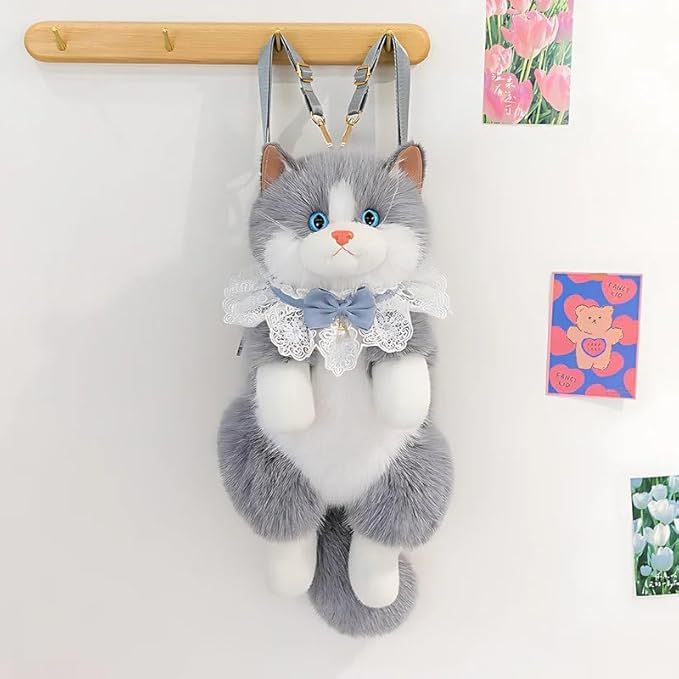 Grey cat backpack hanging on wall hook with postcards